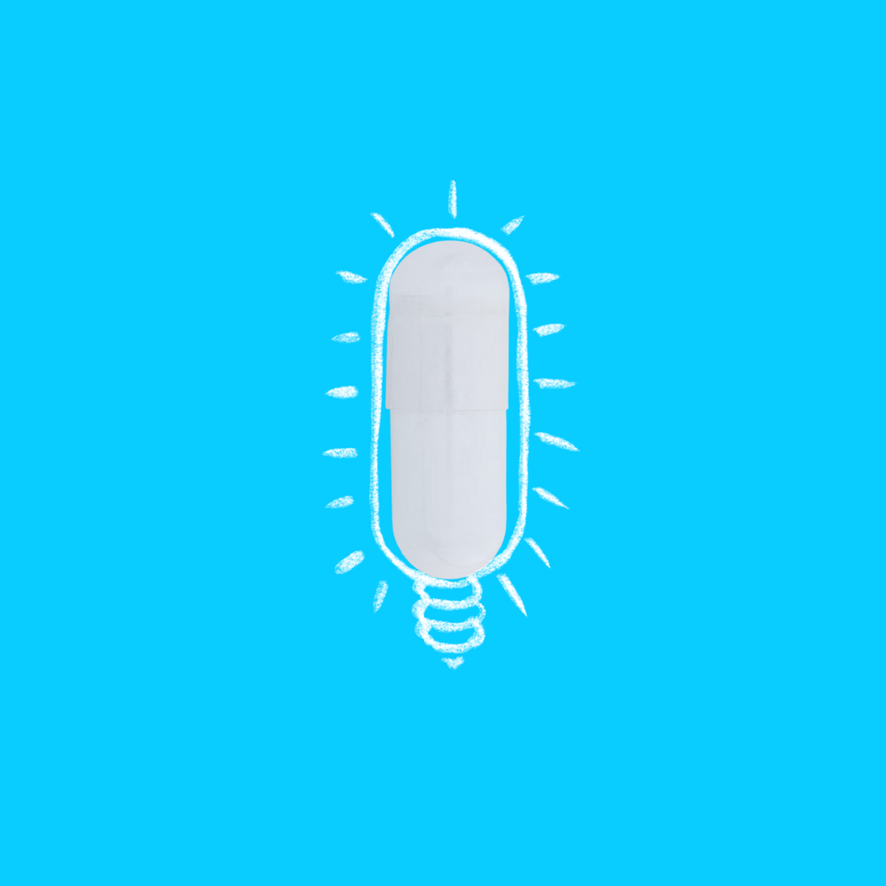 Illustrative conecpt of a white 5HTP capsule pill as a light bulb on a blue background, symbolising a brain power of 5HTP