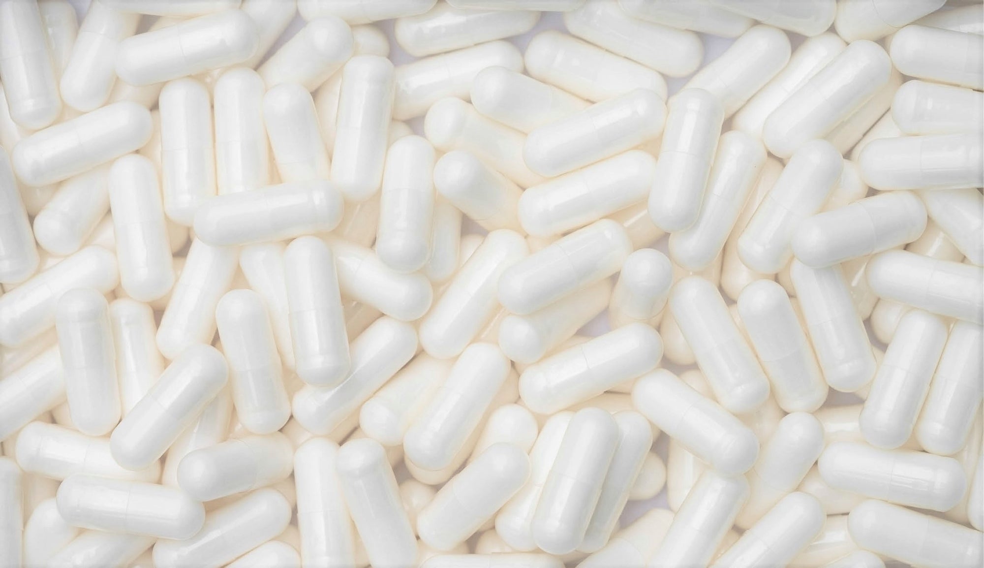 Close-up view of 5-HTP supplement capsules scattered