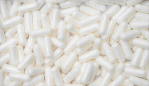 Close-up view of 5-HTP supplement capsules scattered